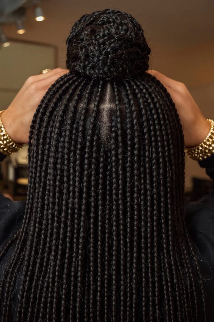 Half-Up Cornrow Bun with Gold Cuffs